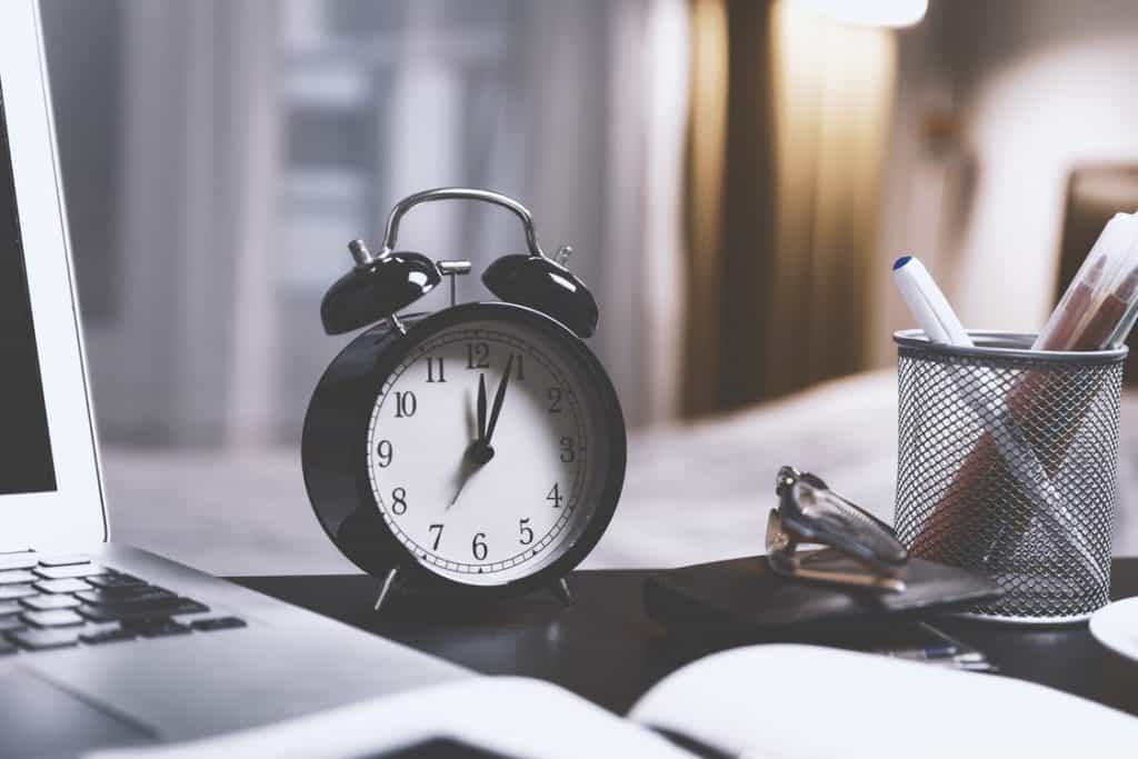 clock sitting on a desk