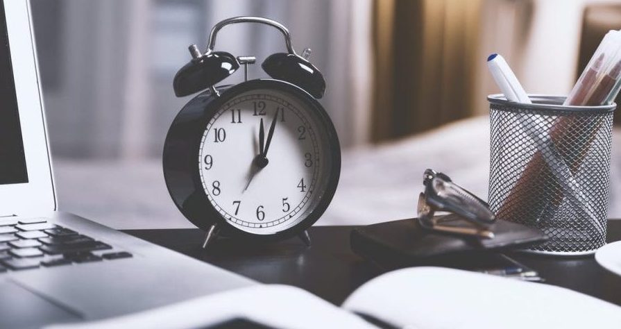 clock sitting on a desk