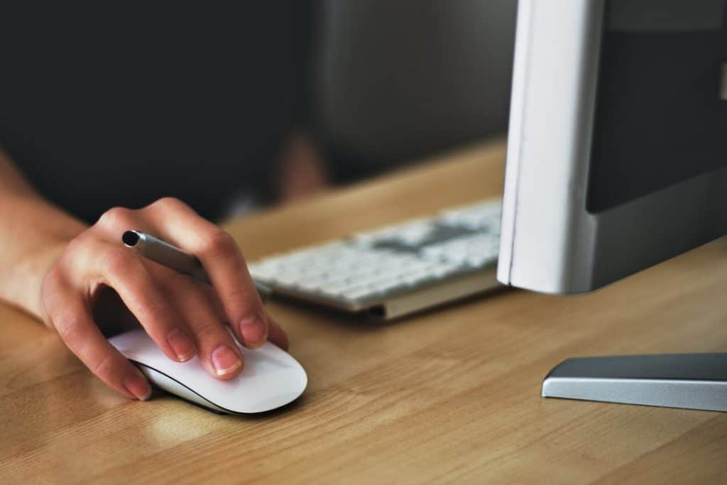 Person clicking through emails